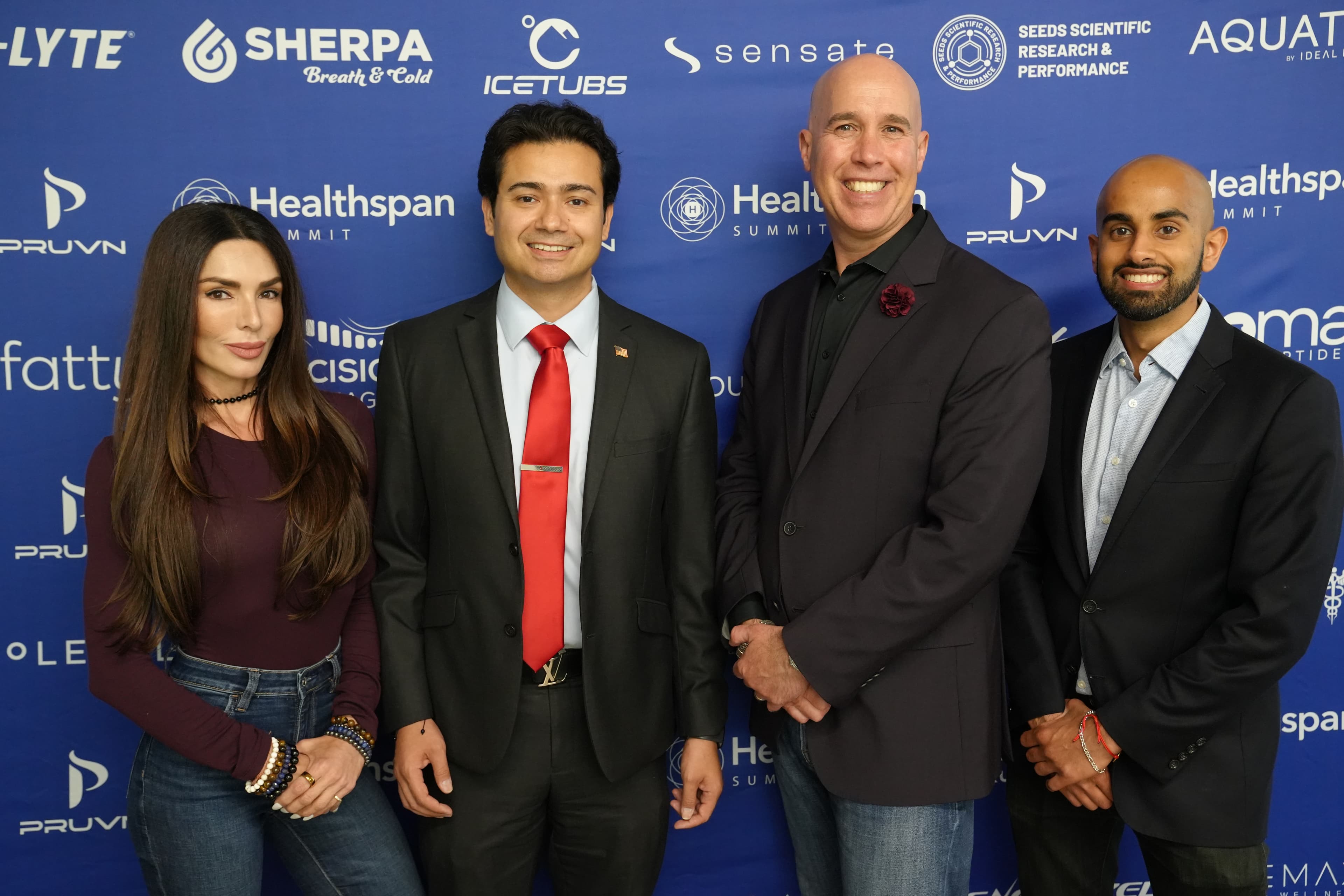 Hosts with sponsors at step-and-repeat